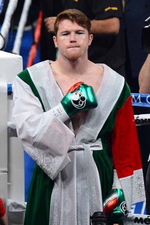 LAS VEGAS, NV - SEPTEMBER 14: Canelo Alvarez enters the ring to take on Floyd Mayweather Jr. in their WBC/WBA 154-pound title fight at the MGM Grand Garden Arena on September 14, 2013 in Las Vegas, Nevada. (Photo by Ethan Miller/Getty Images)