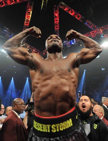 LAS VEGAS, NV - OCTOBER 12: WBO welterweight champion Timothy Bradley Jr. celebrates after defeating Juan Manuel Marquez (not pictured) during their bout at the Thomas & Mack Center on October 12, 2013 in Las Vegas, Nevada. Bradley won in a split-decision. (Photo by Jeff Bottari/Getty Images)