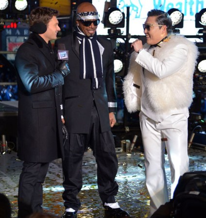 NEW YORK, NY - DECEMBER 31: (L-R) Media personality Ryan Seacrest, rapper MC Hammer (L), and Korean rapper PSY perform during New Year's Eve 2013 In Times Square at Times Square on December 31, 2012 in New York City. (Photo by Mike Coppola/Getty Images)