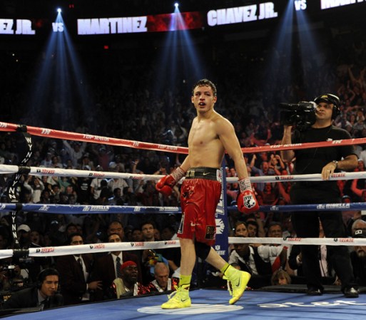 LAS VEGAS, NV - SEPTEMBER 15: Julio Cesar Chavez Jr. (L) is instructed to walk away by referee Tony Weeks after knocking down Sergio Martinez in the twelfth round of their WBC middleweight title fight at the Thomas & Mack Center on September 15, 2012 in Las Vegas, Nevada. (Photo by Jeff Bottari/Getty Images)