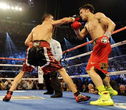 LAS VEGAS, NV - SEPTEMBER 15: Sergio Martinez (L) lands a right to the head of Julio Cesar Chavez Jr. in the seventh round of their WBC middleweight title fight at the Thomas & Mack Center on September 15, 2012 in Las Vegas, Nevada. (Photo by Jeff Bottari/Getty Images)