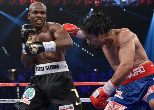 LAS VEGAS, NV - JUNE 09: (L-R) Timothy Bradley lands a left to the head of Manny Pacquiao during their WBO welterweight title fight at MGM Grand Garden Arena on June 9, 2012 in Las Vegas, Nevada. (Photo by Kevork Djansezian/Getty Images)