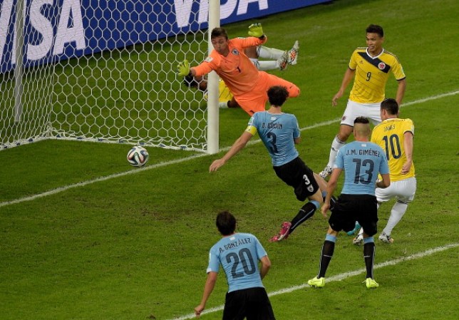 RIO DE JANEIRO, BRAZIL - JUNE 28: James Rodriguez of Colombia scores his team's second goal and his second of the game past goalkeeper Fernando Muslera of Uruguay during the 2014 FIFA World Cup Brazil round of 16 match between Colombia and Uruguay at Maracana on June 28, 2014 in Rio de Janeiro, Brazil. (Photo by Alexandre Loureiro/Getty Images)