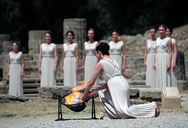 ATHENS, GREECE - MAY 10: High Priestess Ino Menegaki lights the Olympic flame at the Temple of Hera during the Lighting Ceremony of the Olympic Flame at Ancient Olympia on May 10, 2012 in Olympia, Greece. (Photo by Jamie McDonald/Getty Images)