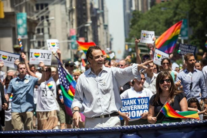 NEW YORK, NY - JUNE 30: New York Governor Andrew Cuomo waves to revelers while marching in the New York Gay Pride Parade on June 30, 2013 in New York City. This year's parade was a particularly festive occasion, due to the recent Supreme Court Ruling that it was unconstitutional to ban gay marriage. (Photo by Andrew Burton/Getty Images)