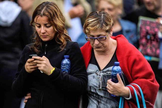SANTIAGO DE COMPOSTELA, SPAIN - JULY 25: Relatives of passengers involved in the train crash wait for news at the Cersia Building on July 25, 2013 in Santiago de Compostela, Spain. The crash occurred on Wednesday at 8.40pm as the train approached the north-western Spanish city of Santiago de Compostela, with 247 passengers on board. At least 77 people have died and a further 131 have been reported injured. The crash occurred on the eve of Santiago de Compostela's main religious festival, which has been cancelled by the City's officials. (Photo by David Ramos/Getty Images)
