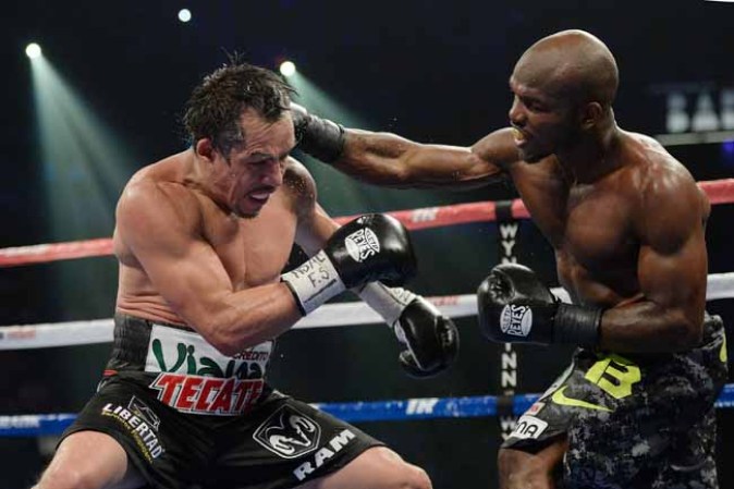 LAS VEGAS, NV - OCTOBER 12: WBO welterweight champion Timothy Bradley Jr. (R) lands a punch to the head of Juan Manuel Marquez during their bout at the Thomas & Mack Center on October 12, 2013 in Las Vegas, Nevada. Bradley won in a split-decision. (Photo by Jeff Bottari/Getty Images)