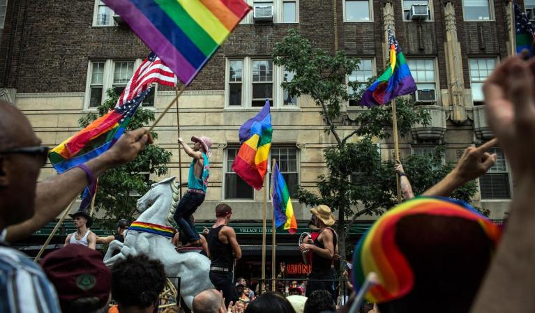 NEW YORK, NY - JUNE 30: Revelers march in the New York Gay Pride Parade on June 30, 2013 in New York City. This year's parade was a particularly festive occasion, due to the recent Supreme Court Ruling that it was unconstitutional to ban gay marriage. (Photo by Andrew Burton/Getty Images)