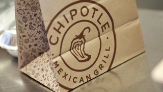 Signage is displayed on a to-go bag at a Chipotle Mexican Grill Inc. restaurant in Louisville, Kentucky, U.S., on Saturday, Feb. 2, 2019.