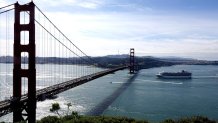 SAN FRANCISCO, March 9, 2020 -- The Grand Princess cruise ship approaches the Golden Gate Bridge on the San Francisco Bay Area, the United States, on March 9, 2020. The U.S. cruise ship linked to a cluster of COVID-19 cases on Monday docked at the Port of Oakland in the state of California. (Photo by Wu Xiaoling/Xinhua via Getty) (Xinhua/Wu Xiaoling via Getty Images)