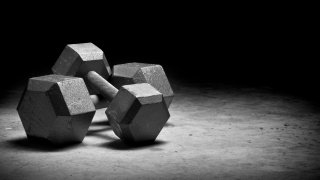 Dumbbells isolated on grungy surface