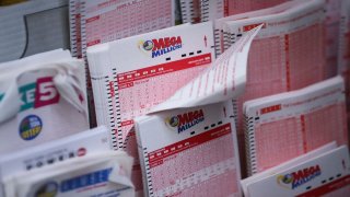 In this Oct. 23, 2018, file photo, Mega Millions lottery tickets sit inside a convenience store in Lower Manhattan in New York City.