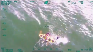 Swimmer being rescued by NYPD Special Ops after being swept by riptide at Rockaway Beach