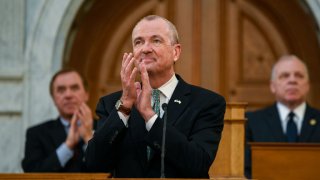 Gov. Phil Murphy claps his hands