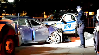 An intoxicated driver slammed into Washington Square Park’s landmark marble arch on Sunday, injuring a police officer who was parked there to protect it, police said.