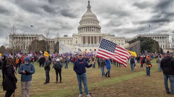 Chris Kelly in front of the U.S. Capitol building around the time of the riot earlier this month.
