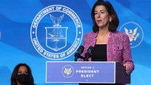 WILMINGTON, DELAWARE - JANUARY 08: U.S. Vice President-elect Kamala Harris (L) looks on as Rhode Island Gov. Gina Raimondo (R) delivers remarks after U.S. President-elect Joe Biden announced her as his Commerce Secretary nominee at The Queen theater on January 08, 2021 in Wilmington, Delaware. Biden announced he is nominating Rhode Island Gov. Gina Raimondo as his commerce secretary, Boston Mayor Martin J. Walsh his labor secretary and Isabel Guzman, a former Obama administration official, as head of the Small Business Administration. (Photo by Chip Somodevilla/Getty Images)