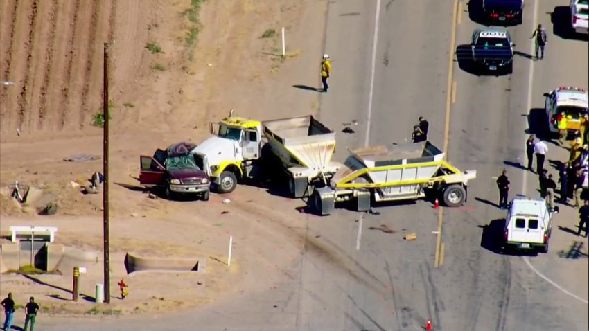 Authorities respond to the scene of a deadly crash involving an SUV and a big rig in Imperial County on Tuesday, March 2, 2021.