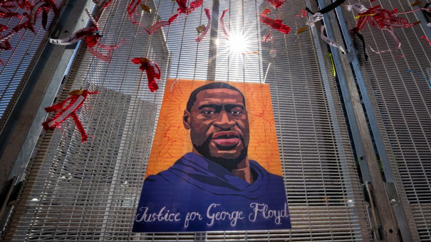 MINNEAPOLIS, MN – APRIL 1 – Posters of George Floyd and Philando Castile are zip tied to the security fence around the heavily secured Hennepin County Courthouse during the trial of Derek Chauvin. The trial of former Minneapolis police officer Derek Chauvin in the death of George Floyd continues on the 18th floor of the heavily secured Hennepin County Courthouse.(Photo by Glen Stubbe, Star Tribune via Getty Images)