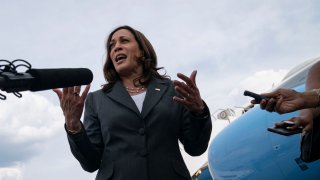 US Vice President Kamala Harris speaks to reporters prior to boarding Air Force Two at Hartsfield-Jackson Airport in Atlanta, Georgia, on June 18, 2021. -