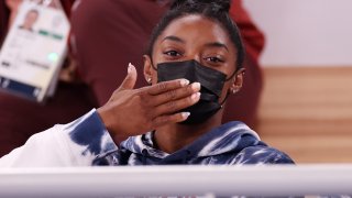 Simone Biles watches competition