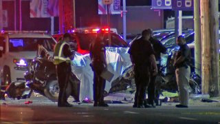 police looking at a car wreck