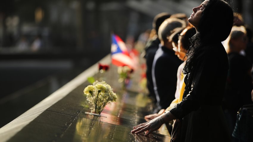 NEW YORK, NEW YORK – SEPTEMBER 11: Alexandra Hamatie, whose cousin Robert Horohoe was killed on September 11, pauses at the National September 11 Memorial during a morning commemoration ceremony for the victims of the terrorist attacks Eighteen years after the day on September 11, 2019 in New York City. Throughout the country services are being held to remember the 2,977 people who were killed in New York, the Pentagon and in a field in rural Pennsylvania. (Photo by Spencer Platt/Getty Images)