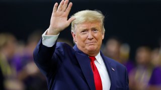 NEW ORLEANS, LOUISIANA - JANUARY 13: U.S. President Donald Trump waves prior to the College Football Playoff National Championship game between the Clemson Tigers and the LSU Tigers at Mercedes Benz Superdome on January 13, 2020 in New Orleans, Louisiana.