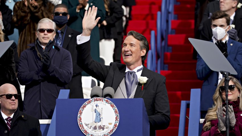 Glenn Youngkin, governor of Virginia, waves while speaking after being sworn in during an inauguration ceremony at Capitol Square in Richmond, Virginia, U.S., on Saturday, Jan. 15, 2022. Youngkin, former co-CEO of the Carlyle Group Inc., is the first Republican elected to the office since 2009. Photographer: Al Drago/Bloomberg via Getty Images