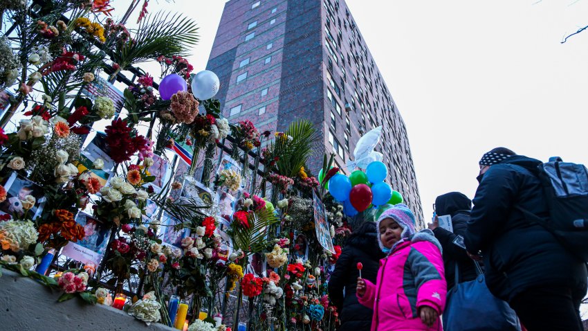 Mourners at memorial for Bronx fire victims