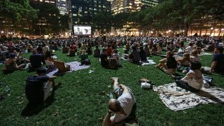 People in Bryant Park watching a movie