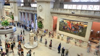 People exploring and walking around The Met