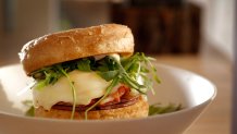Sandwich with Taylor pork roll, fried egg, kimchee, arugula, and english muffin