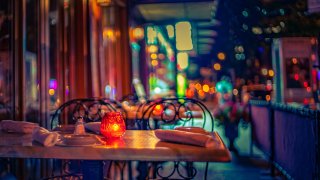 Late night restaurant outdoor seating in Chelsea, Manhattan on a warm summer night.