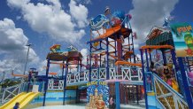 Splash Island water park feature on a partly cloudy day.