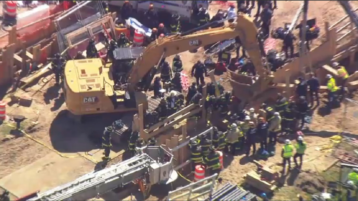 Two construction workers die after being trapped in a collapse at JFK