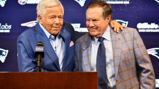 New England Patriots owner Robert Kraft (left) and departing head coach Bill Belichick embrace as they announced Belichick was leaving the team during a news conference at Gillette Stadium in Foxborough, Massachusetts, on Thursday, Jan. 11, 2024.