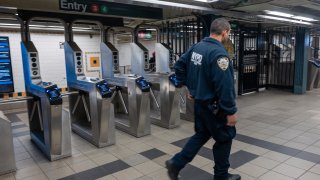 NYPD officers patrol a Brooklyn subway station on March 18, 2024 in New York City. Following a surge in crime on the subways, New York Governor Kathy Hochul revealed a five-point plan to bring state resources, the deployment of 750 National Guard members and 250 New York State and MTA police officers, into the subway system. Violence in the subway system, the nation's largest, has surged this year over last year. (Photo by Spencer Platt/Getty Images)