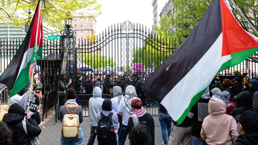 Student Pro-Palestinian protestors chant near an entrance to Columbia University on April 30, 2024 in New York City. New York police entered Columbia University’s campus late April 30, 2024 and were in front of a building barricaded by pro-Palestinian student protesters, an AFP reporter saw. Dozens of people were around Hamilton Hall, on the Columbia campus in the middle of New York City, as police arrived and began pushing protesters outside, the reporter said.