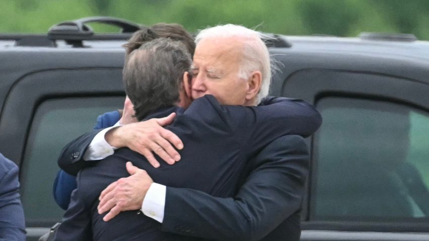 US President Joe Biden hugs his son Hunter Biden upon arrival at Delaware Air National Guard Base in New Castle, Delaware, on June 11, 2024, as he travels to Wilmington, Delaware.