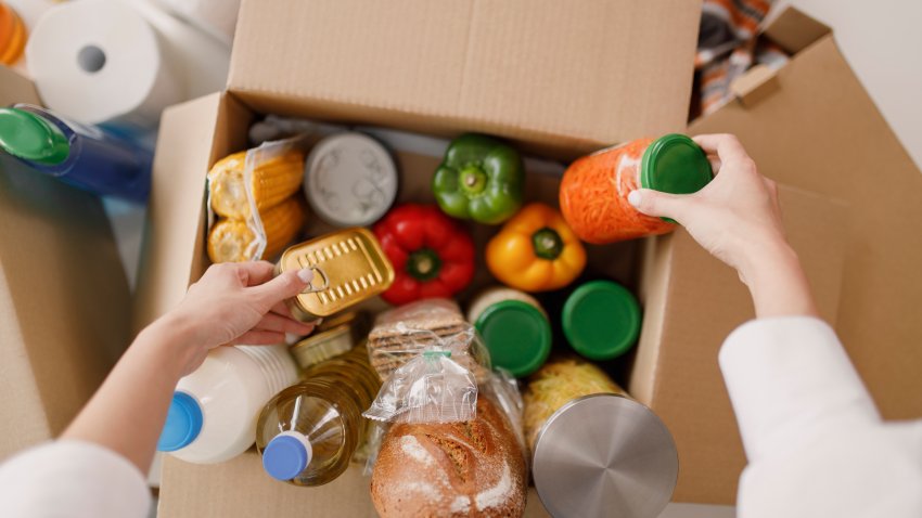 Details of Volunteer with box of food for poor