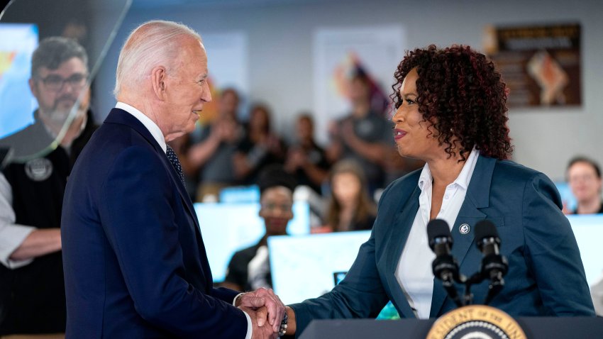 US President Joe Biden, left, and Muriel Bowser, mayor of the District of Columbia, shake hands following an operational briefing at the DC Emergency Operations Center in Washington, DC, US, on Tuesday, July 2, 2024. Biden touted measures to better protect communities from extreme weather, including plans to impose the first-ever federal standards to shield US workers from heat stress. Photographer: Bonnie Cash/UPI/Bloomberg via Getty Images
