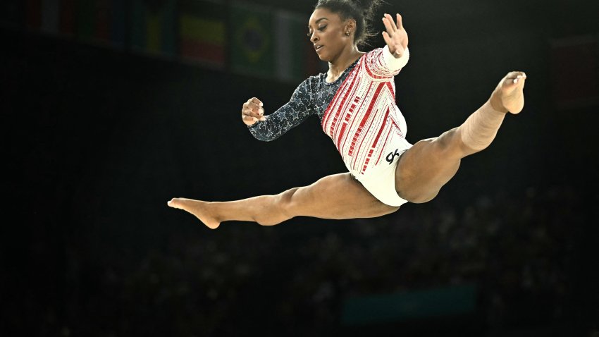 US’ Simone Biles competes in the balance beam event of the artistic gymnastics women’s team final during the Paris 2024 Olympic Games at the Bercy Arena in Paris, on July 30, 2024. (Photo by Lionel BONAVENTURE / AFP) (Photo by LIONEL BONAVENTURE/AFP via Getty Images)