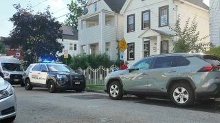 Police at Liberty Street home where three were killed in fire.