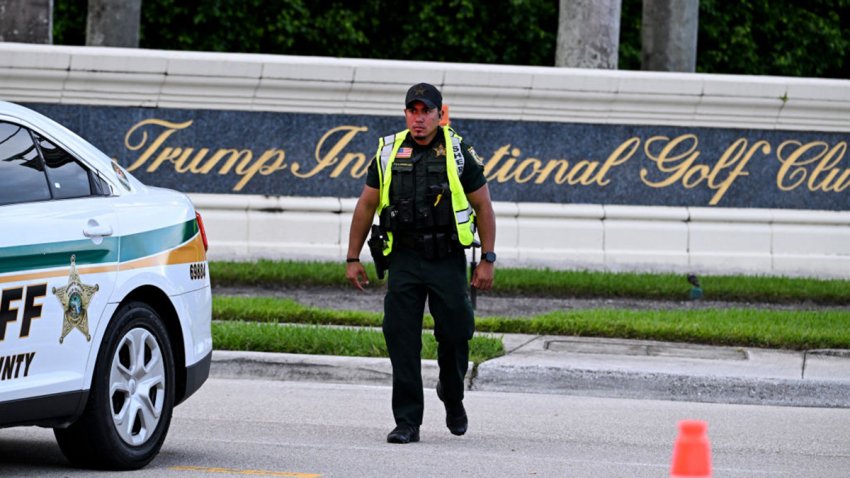 A Sherrif block the street outside the Trump International Golf Club in West Palm Beach, Florida, on September 15, 2024 following a shooting incident at former US president Donald Trump’s golf course. Trump’s campaign reported Sunday that there had been “gunshots in his vicinity” but added that the Republican presidential candidate was safe. (Photo by CHANDAN KHANNA / AFP) (Photo by CHANDAN KHANNA/AFP via Getty Images)