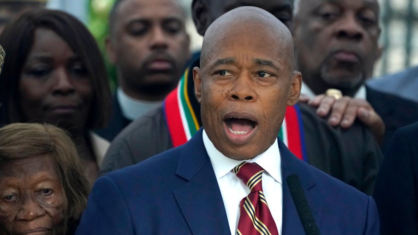 New York City Mayor Eric Adams talks to the press outside Gracie Mansion, the official residence of the mayor of New York City, on September 26, 2024, after he was indicted on federal criminal charges. US federal agents raided the official residence of Mayor Adams early September 26 ahead of the expected announcement of criminal charges against the former city cop once touted as a rising Democratic Party star. The search at the residence known as Gracie Mansion began before dawn, and is the latest shock twist in a graft investigation against the Adams administration. (Photo by TIMOTHY A. CLARY / AFP) (Photo by TIMOTHY A. CLARY/AFP via Getty Images)