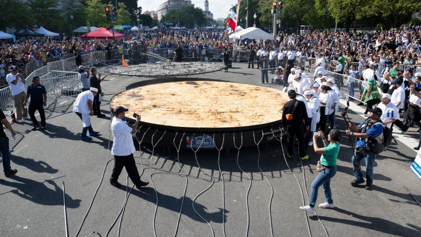 WASHINGTON, DC-SEPTEMBER 28:   Fiesta DC 2024, with the help of dozens of chefs break the Guiness World Records Book for the largest pupusa ever made, in Washington DC on September 28, 2024.  Creating a  20-foot wide pupusa was the goal of a team of chefs trying to beat an 18-foot pupusa that required a team of 40 chefs in El Salvador to use 500 pounds of flour. in (Photo by Marvin Joseph/The Washington Post via Getty Images)