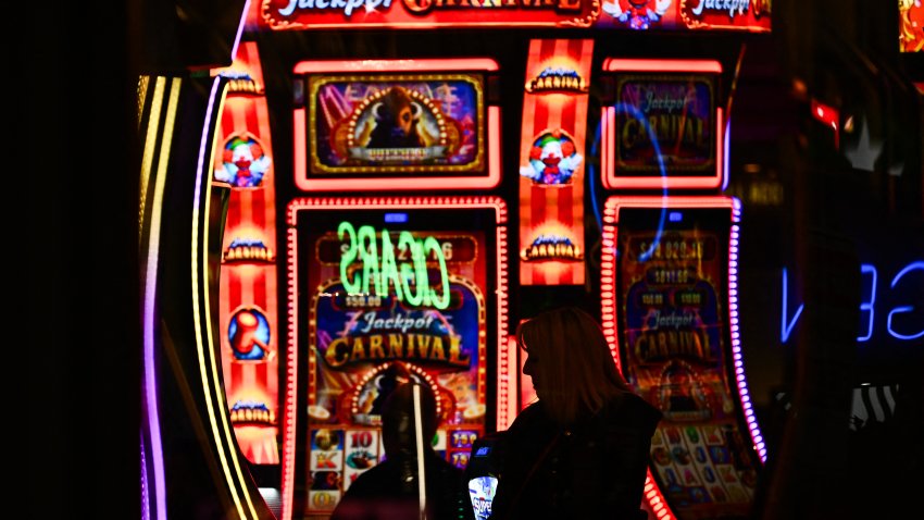 Customers use slot machines inside a casino ahead of a strike deadline for the Culinary Workers and Bartenders Unions contract before the Super Bowl in downtown Las Vegas, Nevada on February 2, 2024. The Kansas City Chiefs will meet the San Francisco 49ers in Super Bowl LVIII on February 11, 2024 at the Allegiant Stadium in Las Vegas. (Photo by Patrick T. Fallon / AFP) (Photo by PATRICK T. FALLON/AFP via Getty Images)