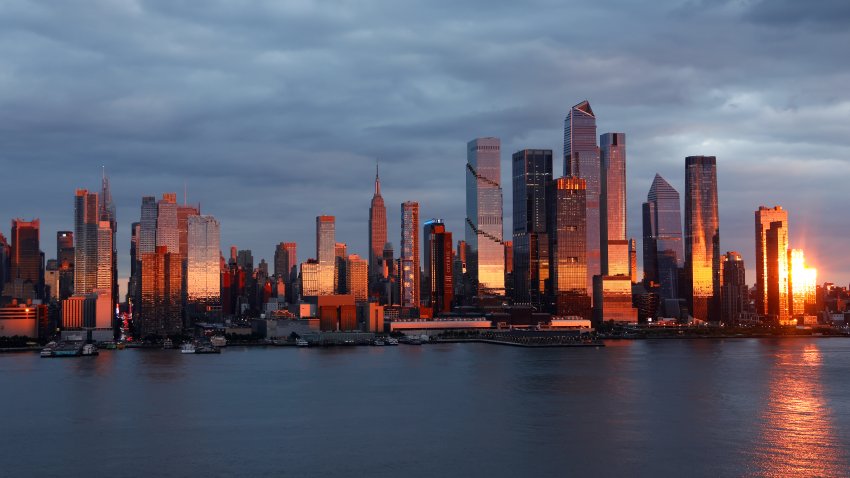 WEEHAWKEN, NJ – SEPTEMBER 22: The sun sets on the skyline of midtown Manhattan, the Empire State Building, and Hudson Yards in New York City on September 22, 2024, as seen from Weehawken, New Jersey.  (Photo by Gary Hershorn/Getty Images)