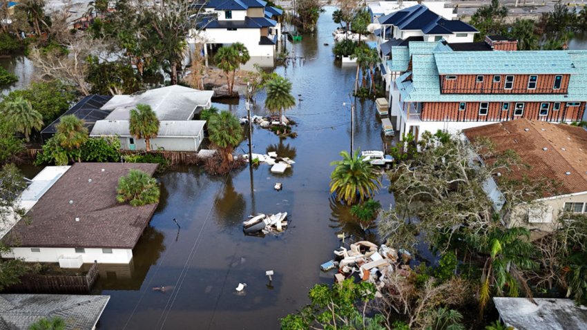 A drone image shows a flooded street due to Hurricane Milton in Siesta Key, Florida, on October 10, 2024. At least four people were confirmed killed as a result of two tornadoes triggered by Hurricane Milton on the east coast of the US state of Florida, local authorities said Thursday. (Photo by Miguel J. Rodriguez Carrillo / AFP) (Photo by MIGUEL J. RODRIGUEZ CARRILLO/AFP via Getty Images)